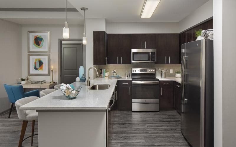 a kitchen with a table and chairs