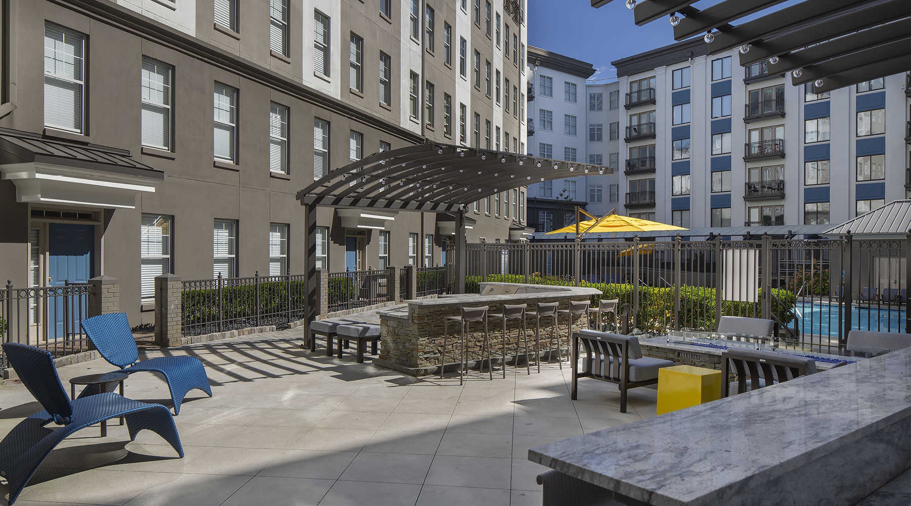 a courtyard with chairs and tables