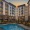 a resort-style pool with a building behind it