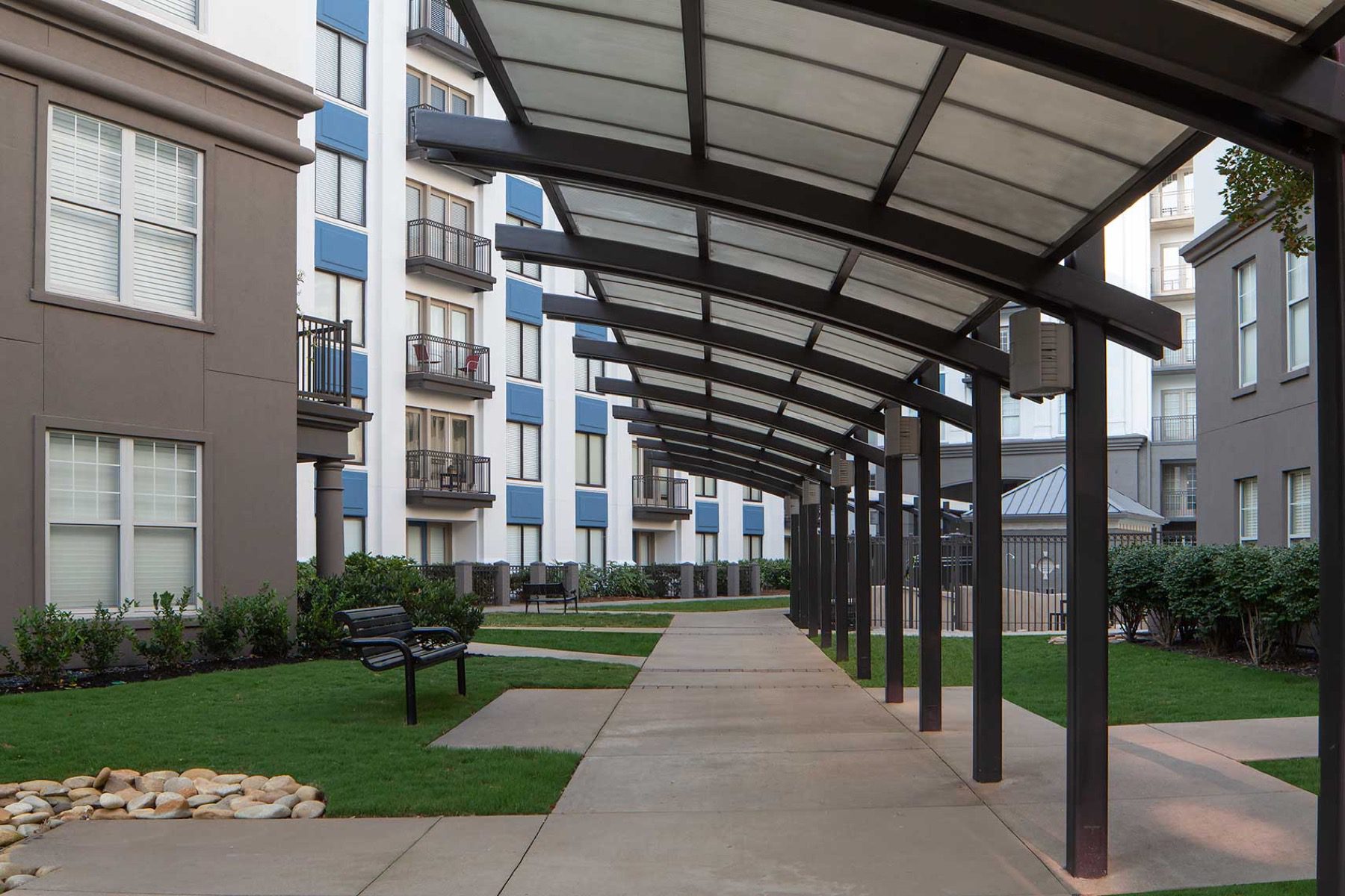 Community building with a covered walkway shelter providing sheltered passage